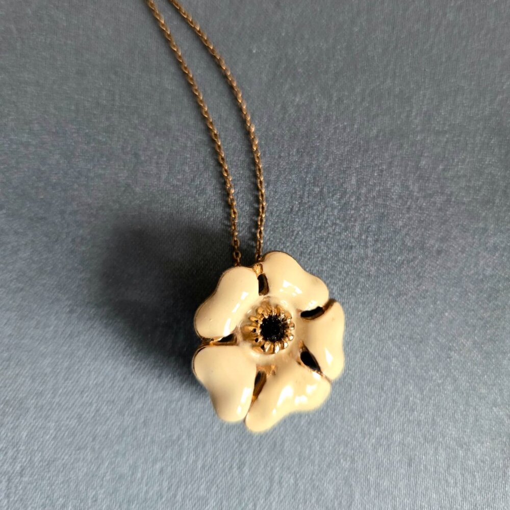 14 K gold filled chain with enameled flower pendant.